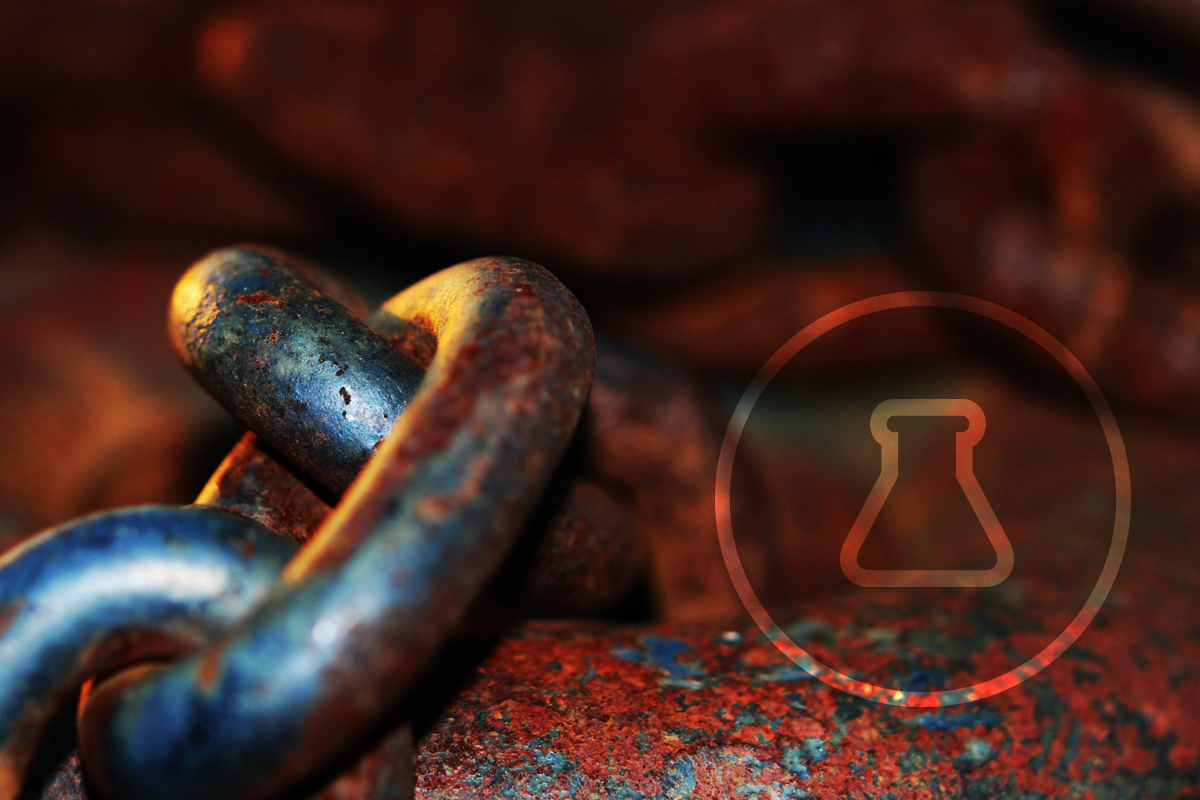 Close up image of metal chain with rust with beaker in circle icon 